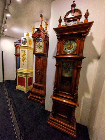 Very intricately decorated Gothic and Baroque grandfather clocks, many carved from hardwood.