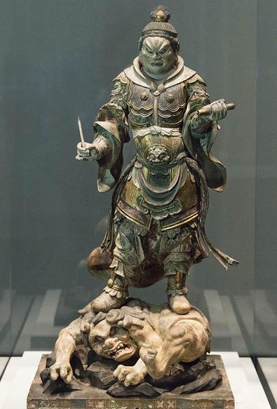 a very detailed and lifelike sculpture, a large demon-king figure, standing on a pig-monster man, he is holding a slender spike in his hand, a cylinder in his other, a harsh but relaxed look on his face , he wears a crown