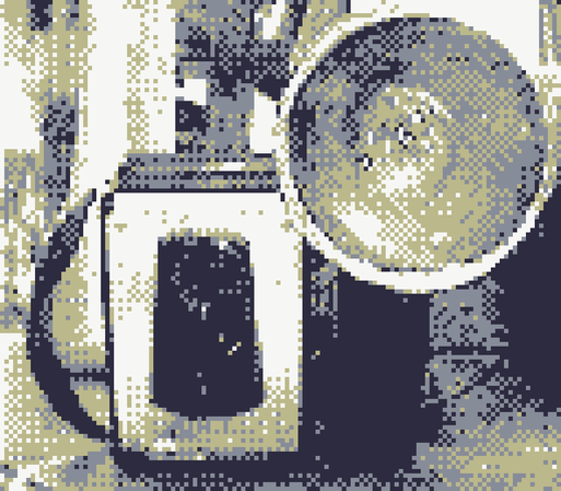 low resolution, pixelated photo: a front-on shot of a vintage camera.