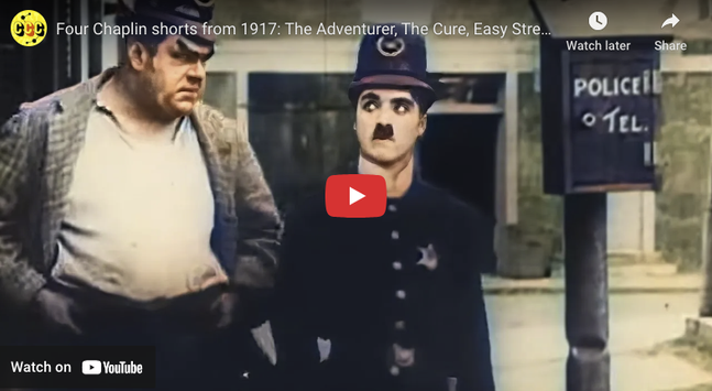 The image is a screenshot from a YouTube video featuring two characters from a silent film. The character on the left is a heavyset man wearing a checkered jacket over a white shirt, with his hands in his pockets, looking serious. The character on the right is dressed in a dark police uniform with a hat, sporting a distinctive mustache, and appears to be looking at the camera with a surprised expression. In the background, there is a sign that reads "POLICE TEL." The video is titled "Four Chaplin shorts from 1917: The Adventurer, The Cure, Easy Stre..." and includes a play button overlay, indicating it is a video thumbnail. The overall color tone of the image is muted, with a vintage appearance, consistent with early 20th-century film.

Provided by @altbot, generated privately and locally using Ovis2-8B