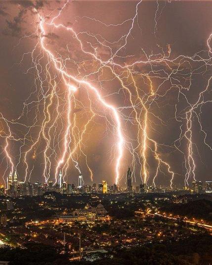 A massive lightning storm over a city.