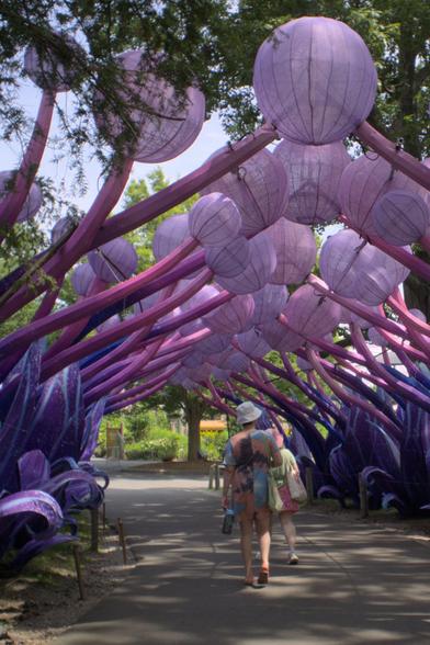 My wife and my mom pass under an organic-looking archway composed of pink rib-like structures and purple spheres. At night during the zoo lights event this and many other sculptures around the park will be illuminated.