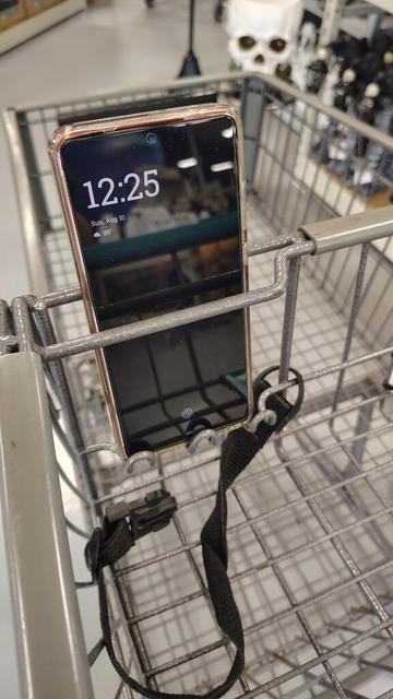 This shopping cart with a built in phone holder.