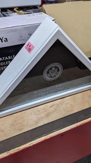 Barbara L. Williams memorial flag display case for sale in an outlet store in Costa Rica