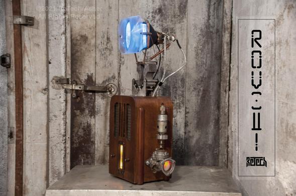 A device composed of an art deco wooden radio body and a 4" black and white functioning TV screen mounted on top.