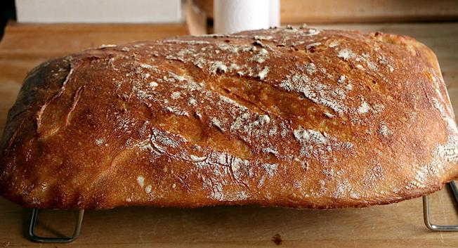 Looking down on the loaf, rather than any of the expected shapes it's rather slumped into approximately the shape of the tray in which it was baked.