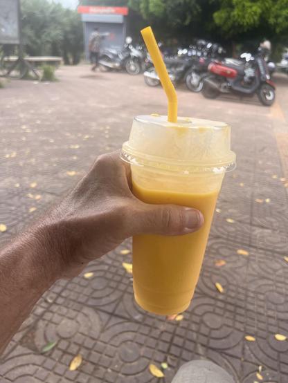 Mango shake from street vendor. Been buying food and her delicious drinks for years here