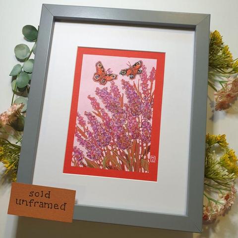 A small original artwork of two peacock butterflies flying over purple and pink toned Buddleia bush flowers. The artwork has a pink background and is on red paper.
An original art work
Colour pencil and mixed media on acid free toned artist paper
5 by 7 inches (12.7 by 17.8 cm).
Sold unframed