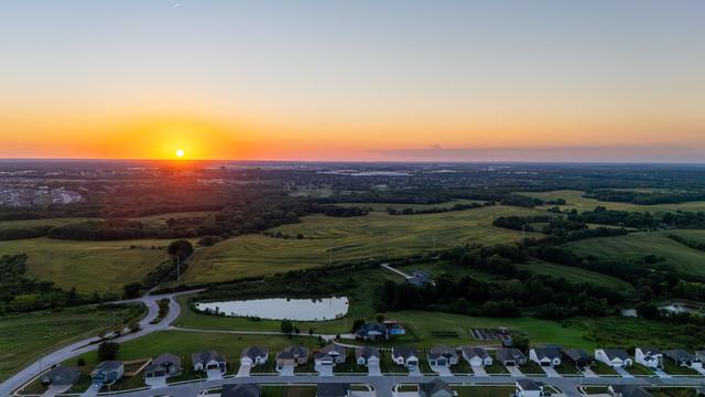 Aerial picture taken from DJI Mini Pro 4 Drone of the sunset. To the right of the sun is Kansas City International Airport.