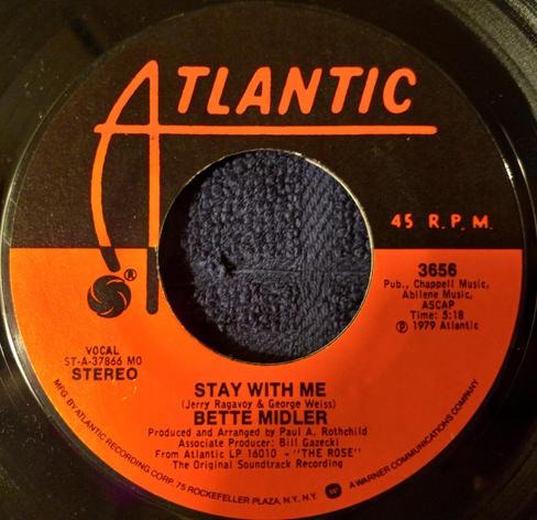 The 45 RPM vinyl record B-side of "The Rose" by Bette Midler. This is "Stay with Me" on Atlantic Records from 1979.