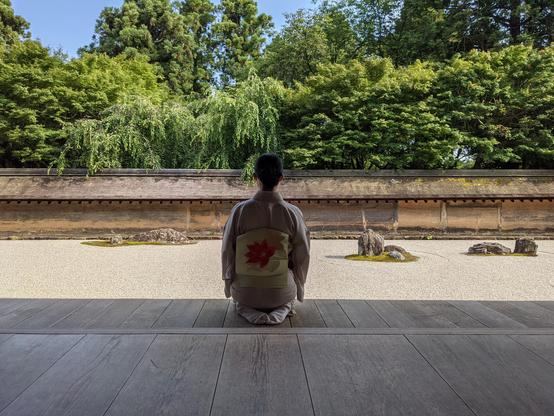 A moment of contemplation before Ryoan-ji's dry landscape garden.