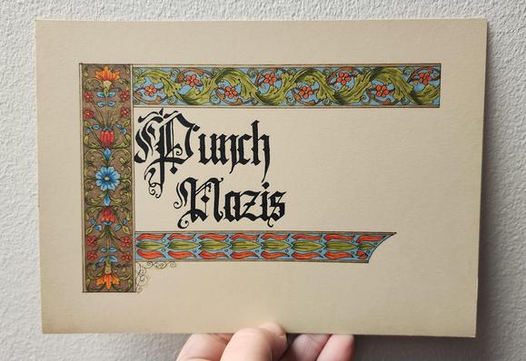 'Punch Nazis' calligraphed in fancy blackletter script in black ink. There are bars of repeating floral leafy patterns down the left, along the top, and across the bottom, coloured in brown, green, blue, and red, with gold highlights.