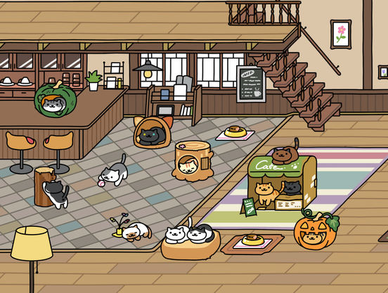 Cartoon illustrated café with various cats sitting on or interacting with toys, beds, and play houses scattered around the area.