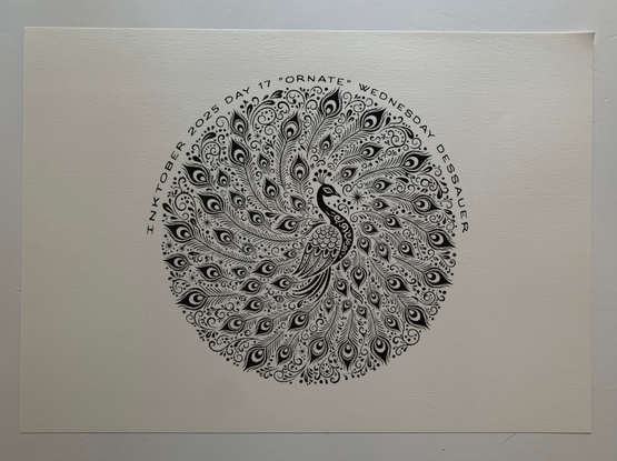 An Art Nouveau style decorative motif in black ink line work depicting a peacock with tail feathers forming a perfectly circular composition.