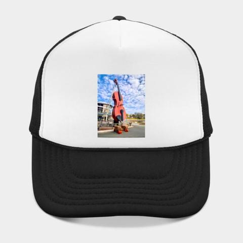 The World’s Largest Fiddle located on the Sydney waterfront next to the Joan Harriss Cruise Pavilion greets visitors as they arrive via cruise ship. The fiddle and bow reach a height of 60 feet!"
Made of solid steel, the giant fiddle was dubbed FIDHEAL MHOR A’ CEILIDH or the “Big Fiddle of the Ceilidh”. Ceilidh is a Gaelic word which translates into "visit."
The Big Fiddle, as many call it, was designed and constructed by Cyril Hearn in 2005. It is a tribute to the folk music and traditions of the province’s Celtic community.
Photography by Debra Martz
Image  printed on a baseball cap. The World’s Largest Fiddle located on the Sydney waterfront next to the Joan Harriss Cruise Pavilion greets visitors as they arrive via cruise ship. The fiddle and bow reach a height of 60 feet!"
Made of solid steel, the giant fiddle was dubbed FIDHEAL MHOR A’ CEILIDH or the “Big Fiddle of the Ceilidh”. Ceilidh is a Gaelic word which translates into "visit."
The Big Fiddle, as many call it, was designed and constructed by Cyril Hearn in 2005. It is a tribute to the folk music and traditions of the province’s Celtic community.
Photography by Debra Martz
Image  printed on a baseball cap.