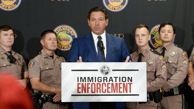Ron DeSantis stands at press conference with Florida Highway Patrol officers next to him Ron DeSantis stands at press conference with Florida Highway Patrol officers next to him