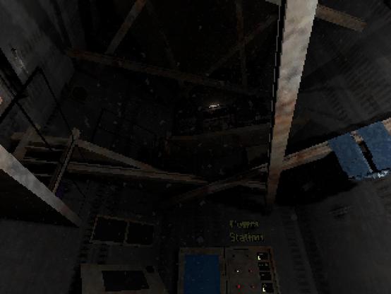 Looking up at a dark, cavernous station of rusted metal.  A few doors and lights can be seen, as well as a computer console and a power station.  There are beams going across the space at various heights and angles.  From one, hangs a pair of blue jeans.