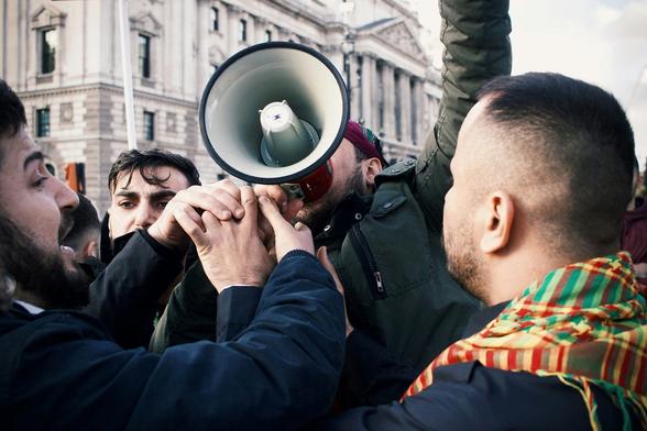 man shouting into a megaphone