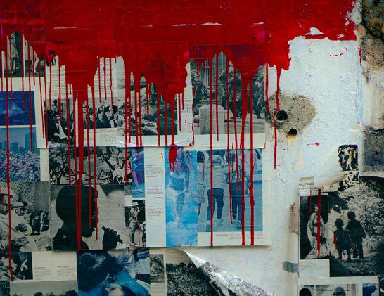 An old wall has various photos pinned to it — black and white, colored, from magazines. They show people, children, profiles, groups. There is a blanks space on the wall with two holes in it. Dripping from the top of the frame is red paint, the lines of which cover most of the photos.
