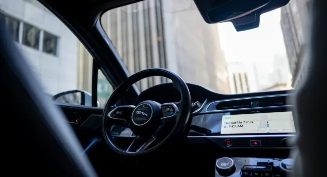 A photo of the inside of a driverless ride-share vehicle in Waymo's fleet