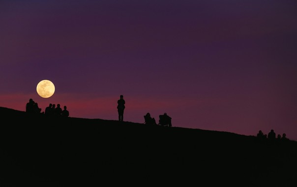 #Unsplash #image by Todd Diemer of "silhouette of group of people under #purple #nightsky" 
#Moon over Mount Tamalpais 

www.Unsplash.com/photos/silhouette-of-group-of-people-under-purple-night-sky-x9TZjFdvr0Y